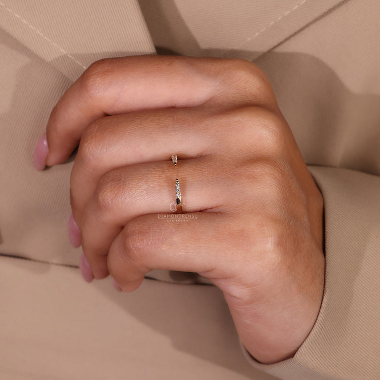 Yellow gold wedding band in prong setting