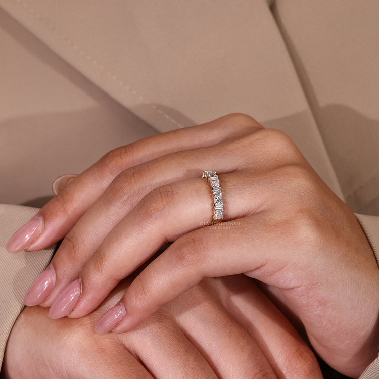 Prong set wedding band with lab grown princess and baguette stones.