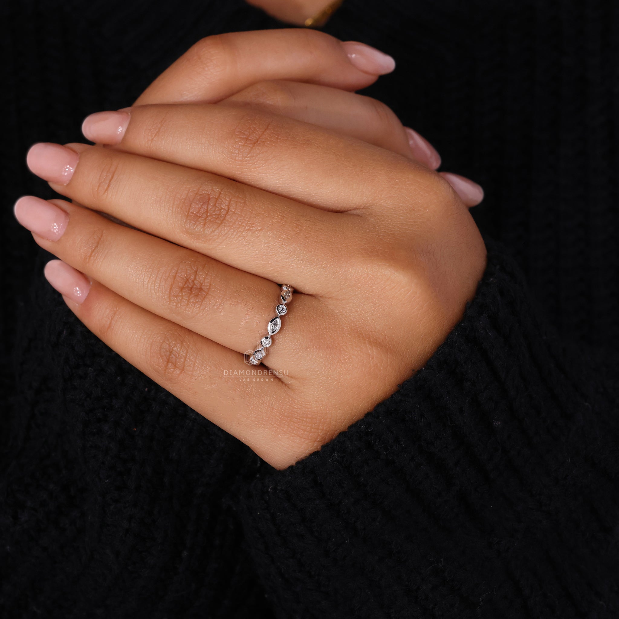Custom diamond band designed with round and marquise cuts.