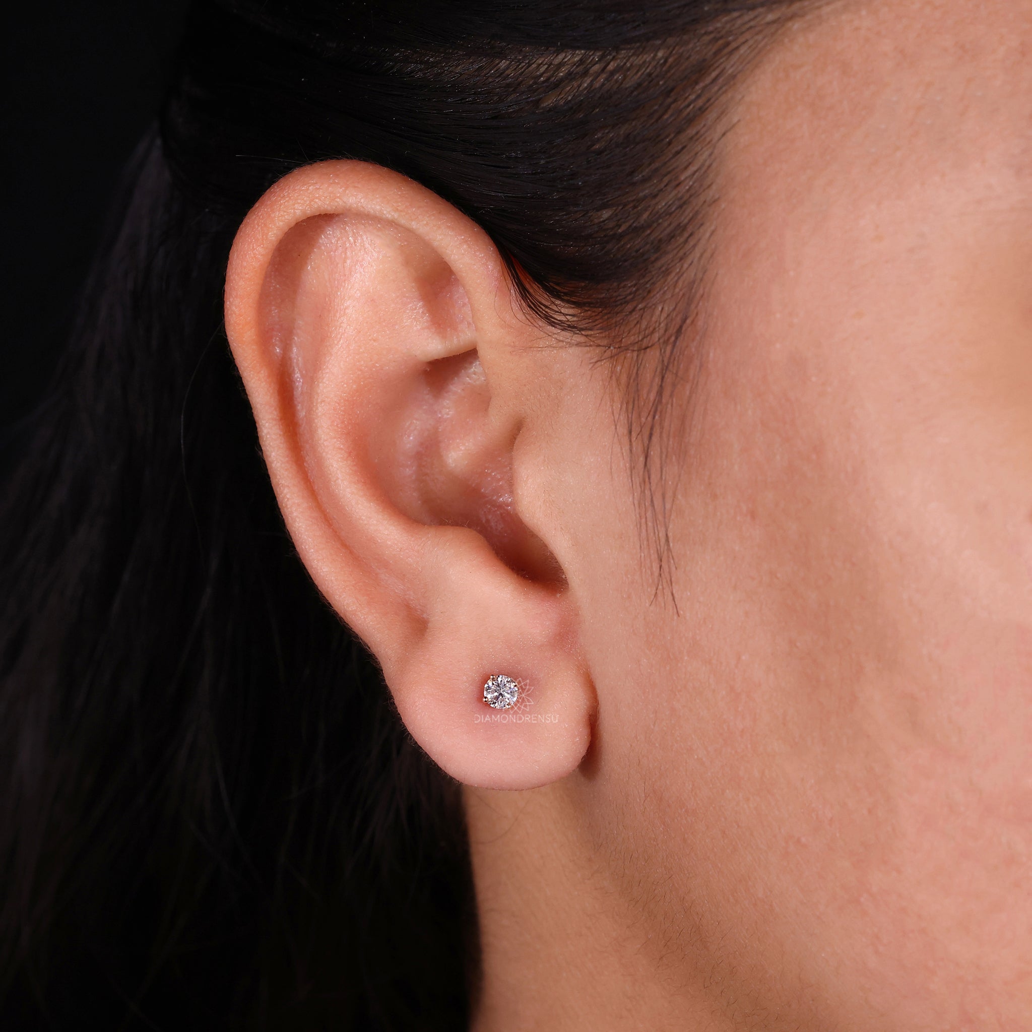 0.29 TCW rose gold diamond earrings.