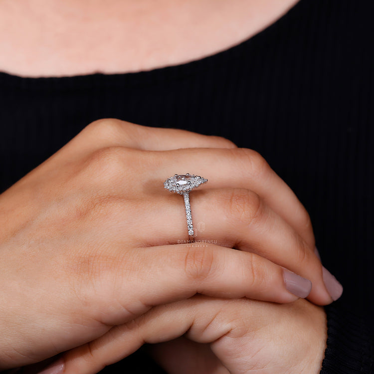 IGI certified pear cut diamond engagement ring in a delicate setting.