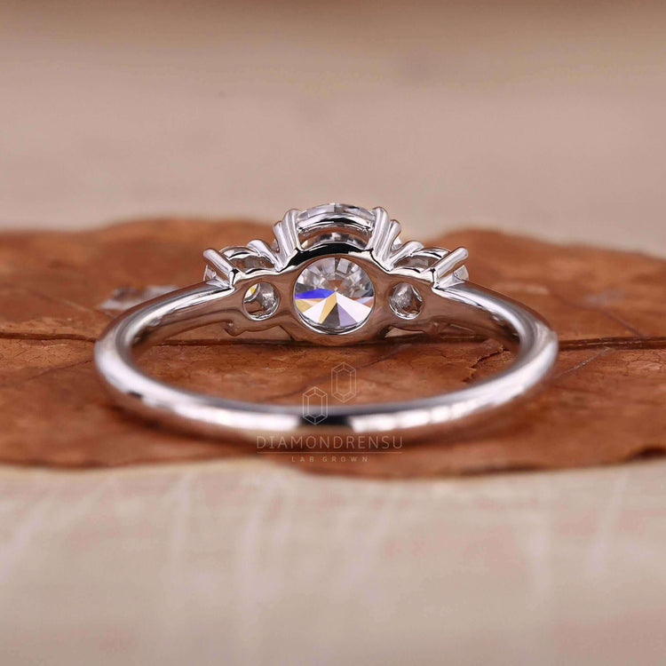 Round brilliant cut diamond ring paired with a Lab Grown Diamond for an eco-friendly and unique engagement ring.
