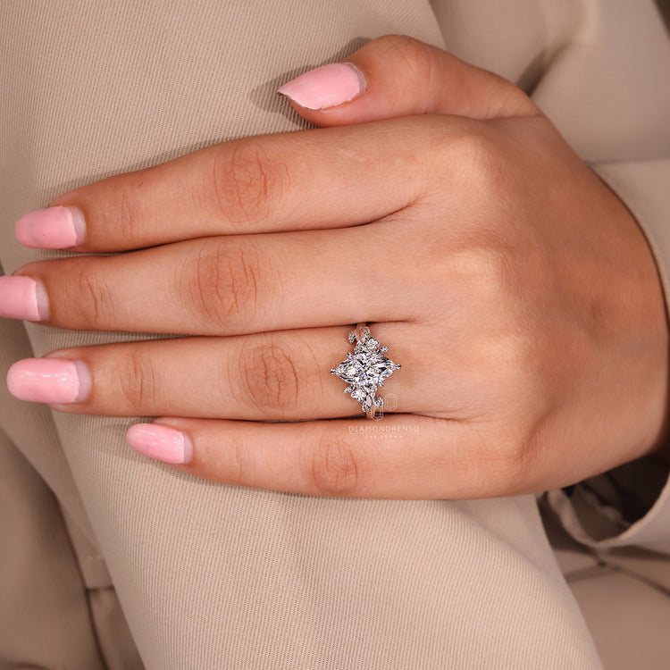 Custom engagement ring with cluster and prong design.