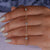 Close-up of a gold chain bracelet with intricate chain links. Close-up of a gold chain bracelet with intricate chain links.