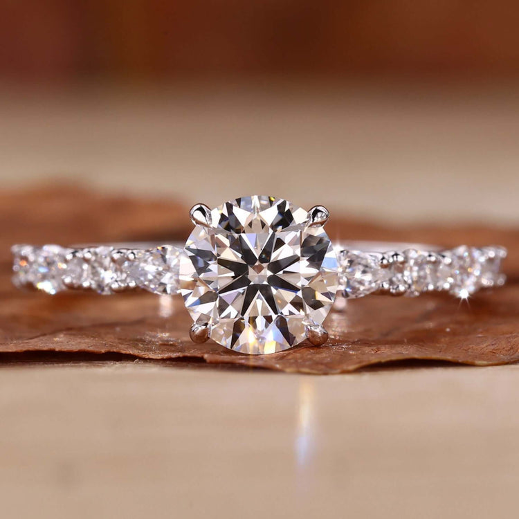 Elegant hidden halo ring showcasing a sparkling centre diamond.