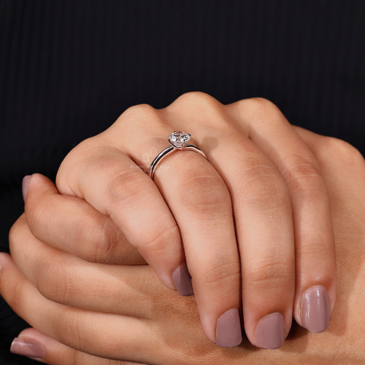 White gold ring styled as solitaire ring in white gold.