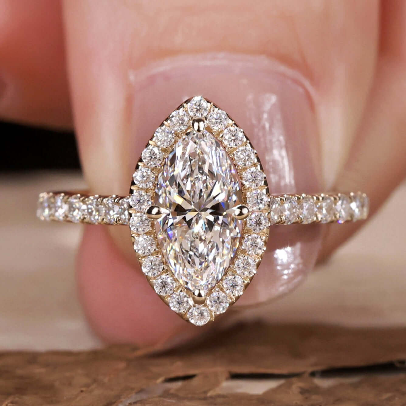 Marquise engagement ring with a stunning halo diamond design