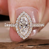 Marquise engagement ring with a stunning halo diamond design