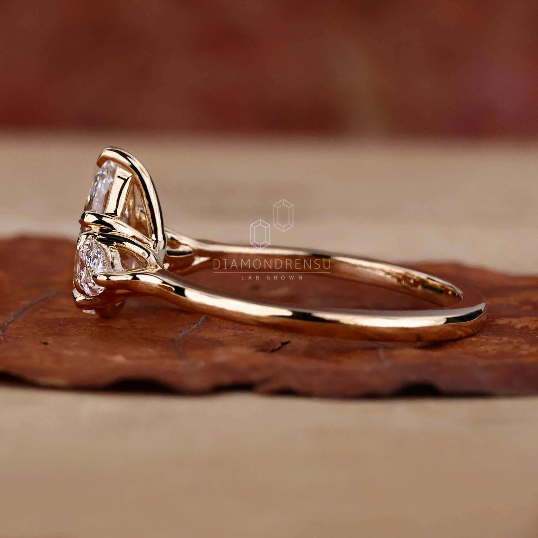 Engagement ring teardrop style with lab-grown diamonds.