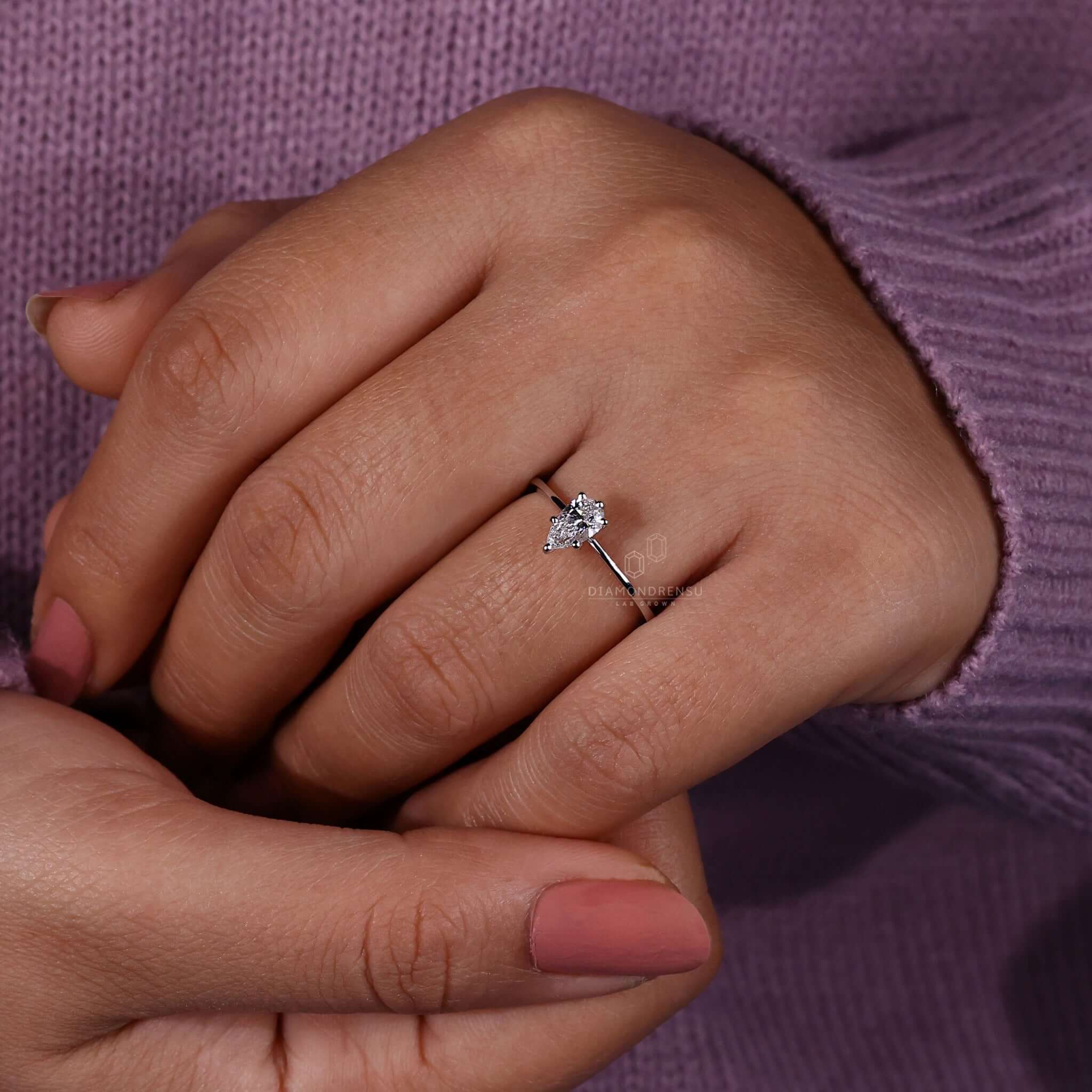 Elegant pear shaped diamond ring perfect for a timeless look.