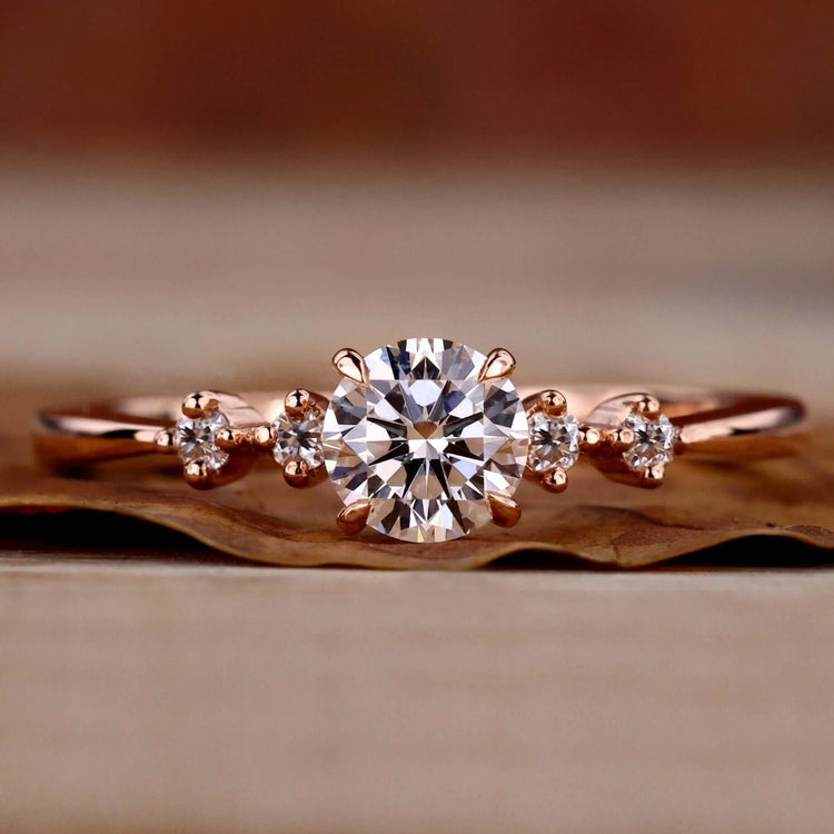 5 stone diamond ring with round diamonds, featuring a 4 prong claw setting and crafted for a unique engagement ring.
