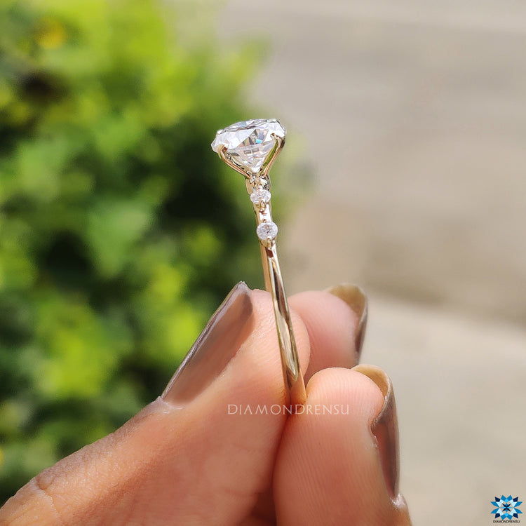 Sparkling moissanite ring set in yellow gold with a timeless 4 prong look.