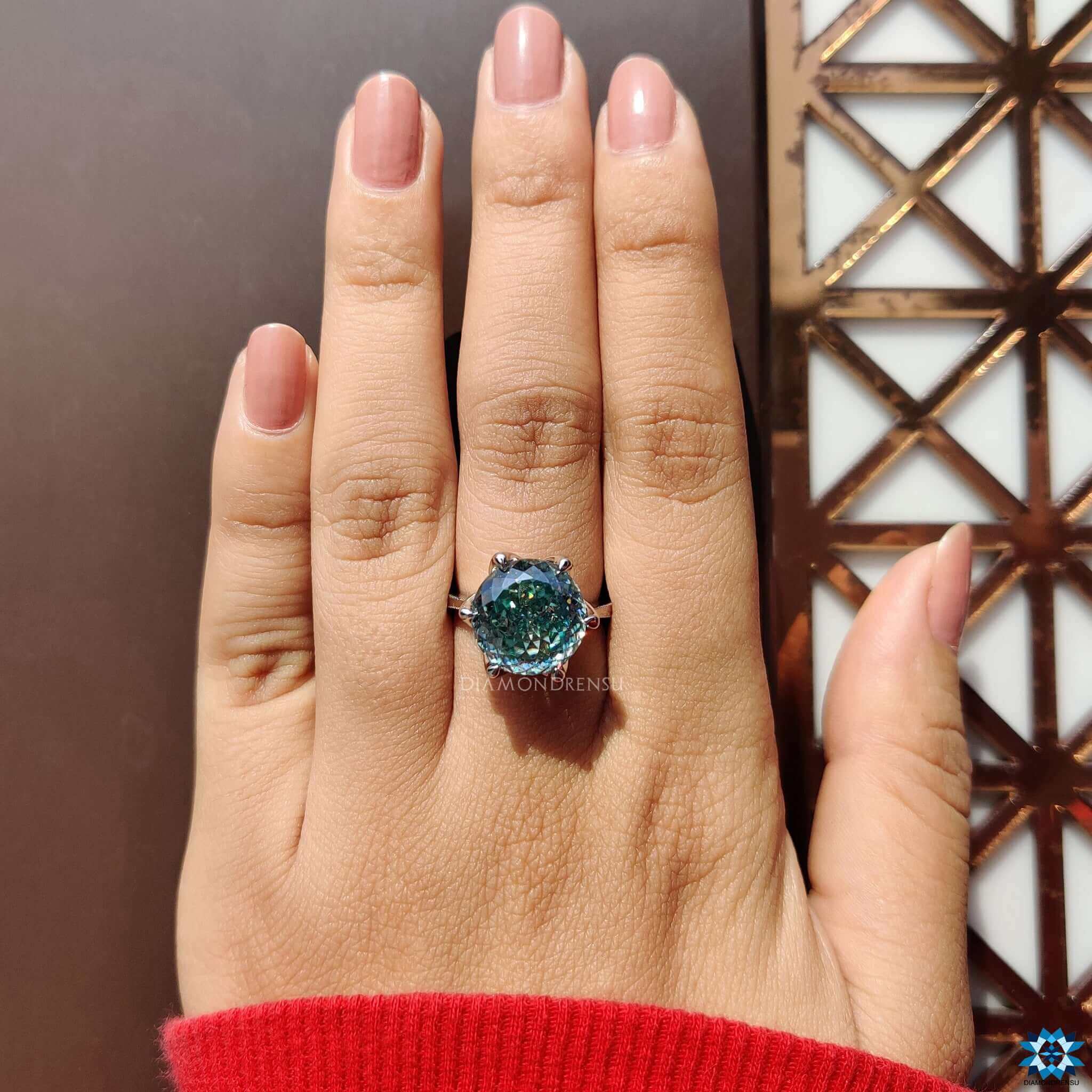 Prong set solitaire moissanite engagement ring.