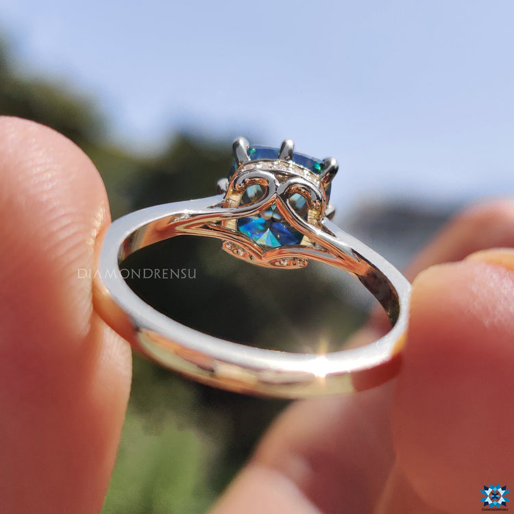 Round cut hidden halo ring with cushion moissanite in yellow gold.