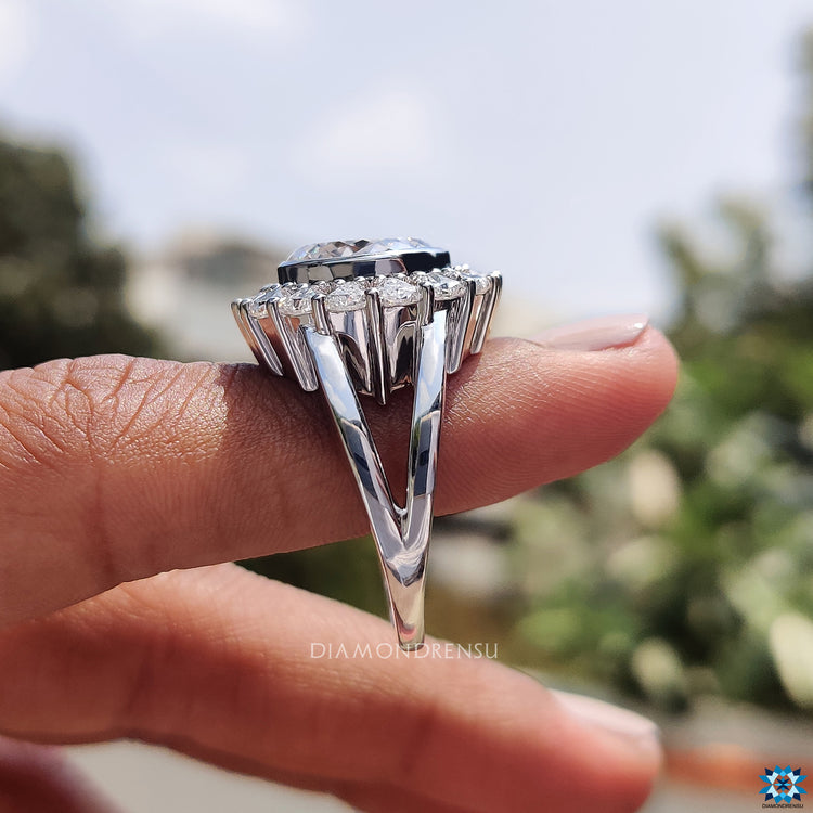 Moissanite for engagement ring in vintage bezel and halo setting.