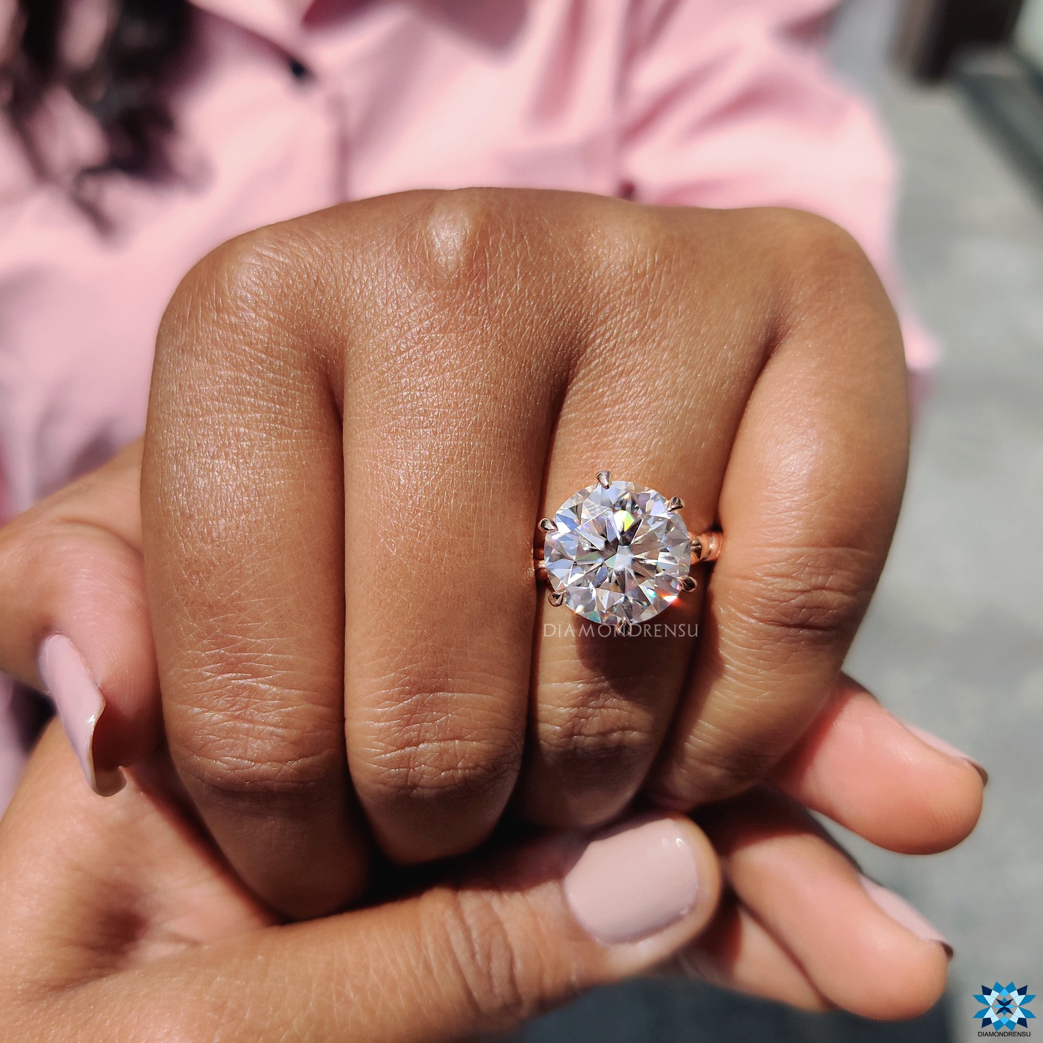UK engagement ring with round cut moissanite and detailed twisted band.