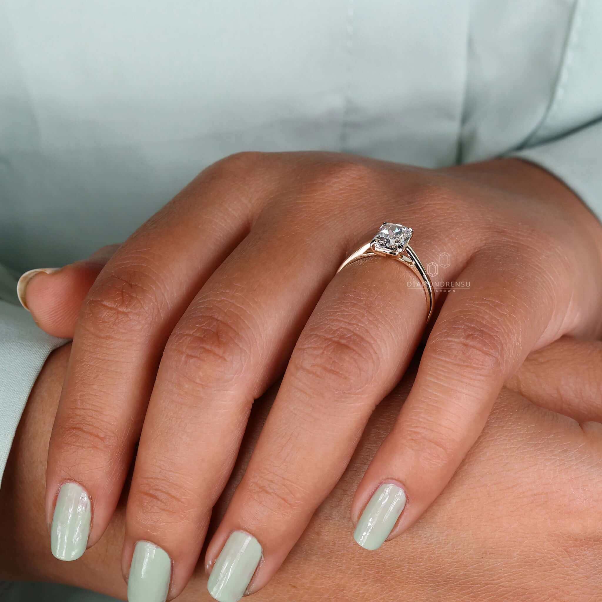 Solitaire diamond ring set with a lab-grown diamond in a prong claw design.