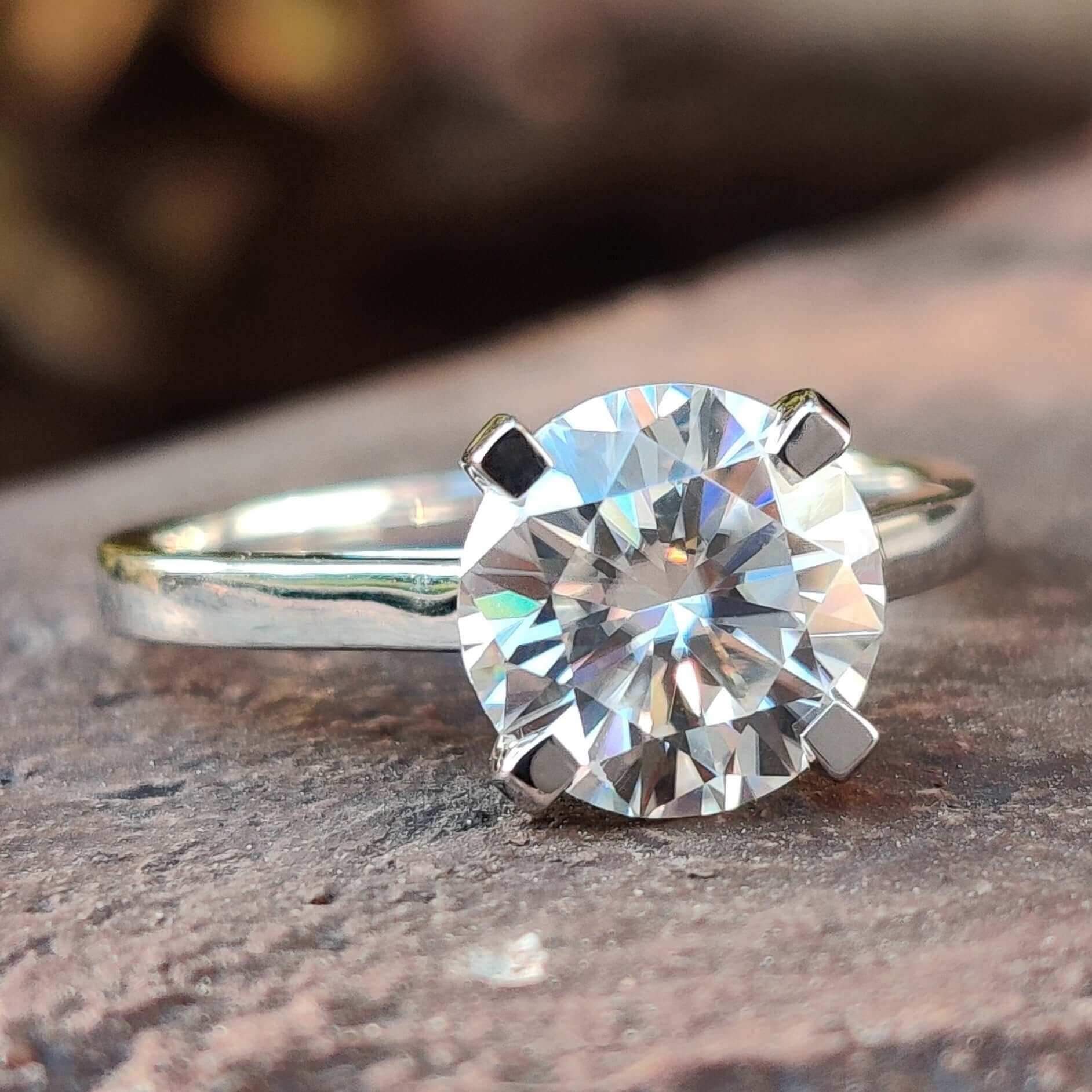 Round cut moissanite solitaire ring.