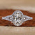 Oval diamond ring with pave setting and elegant side stones.
 Oval diamond ring with pave setting and elegant side stones.