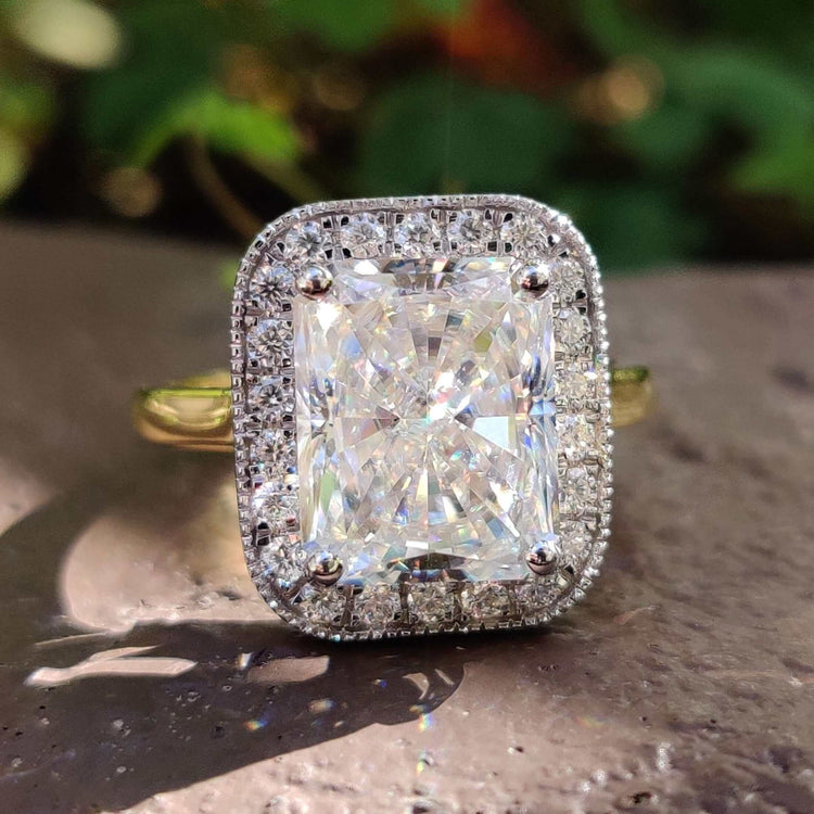 Radiant cut moissanite engagement ring in yellow gold.