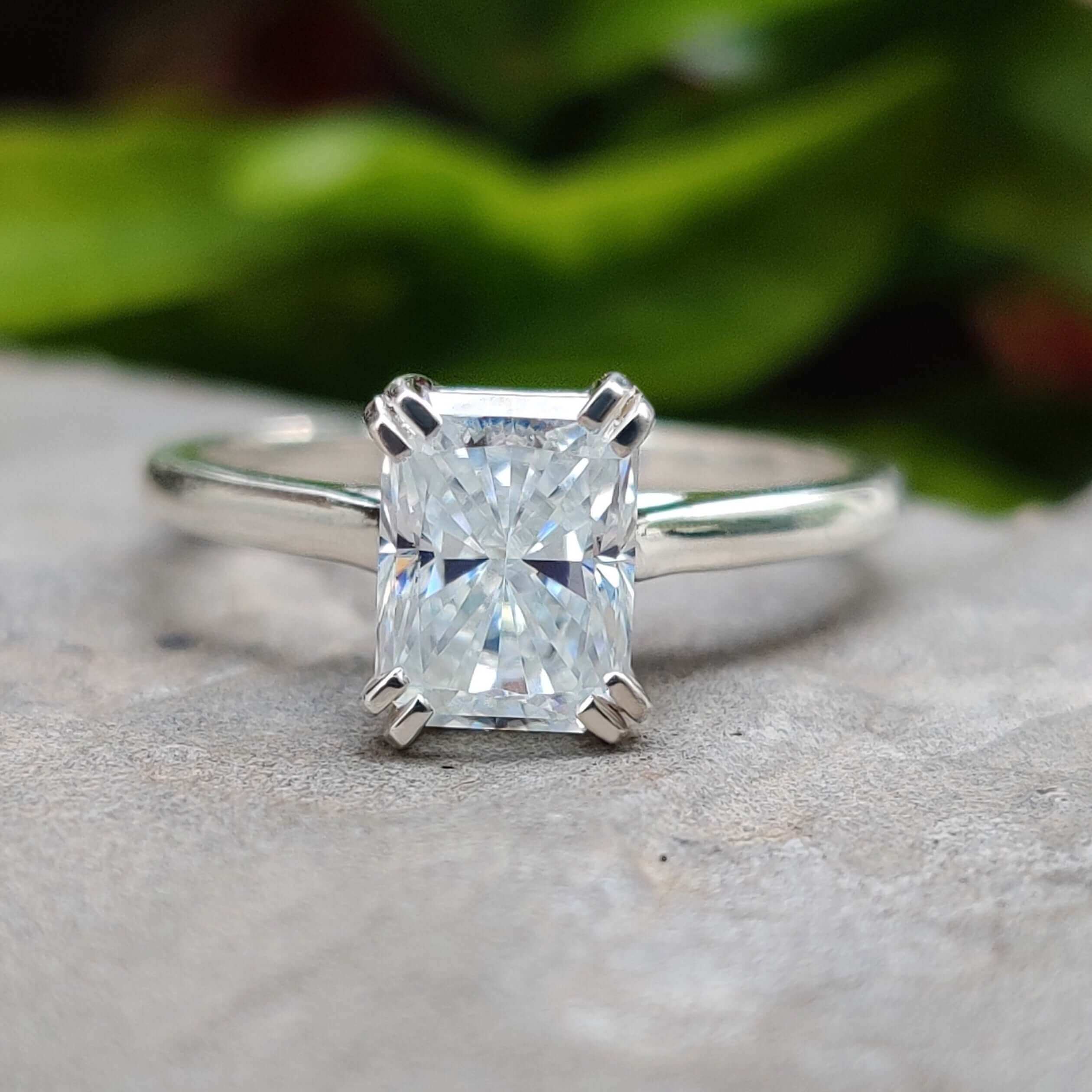 Radiant cut moissanite engagement ring in white gold.