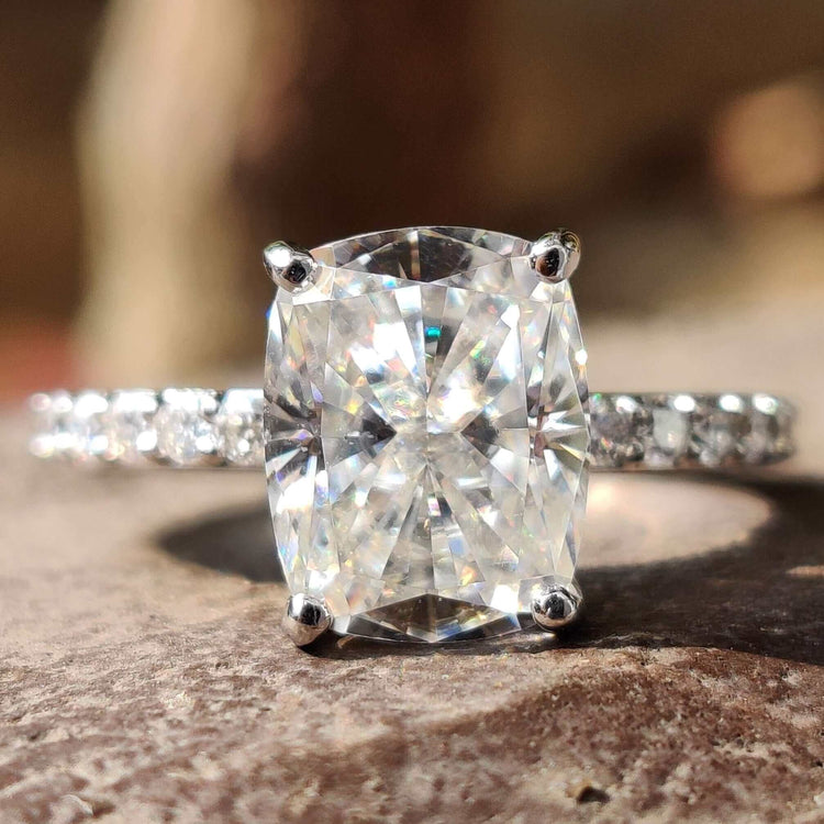 Elongated cushion cut moissanite engagement ring in white gold.