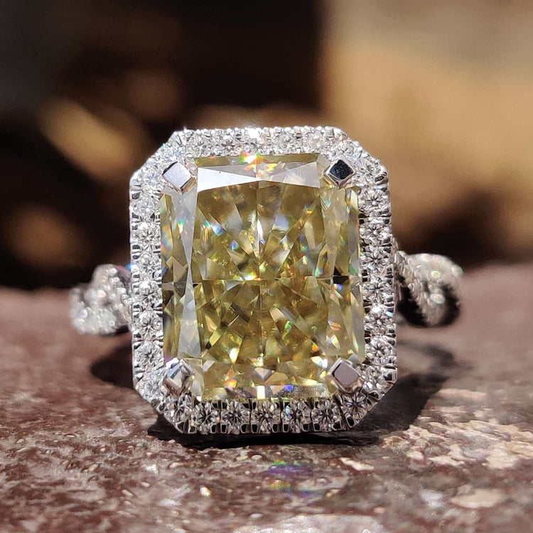 Radiant cut moissanite engagement ring with round halo.