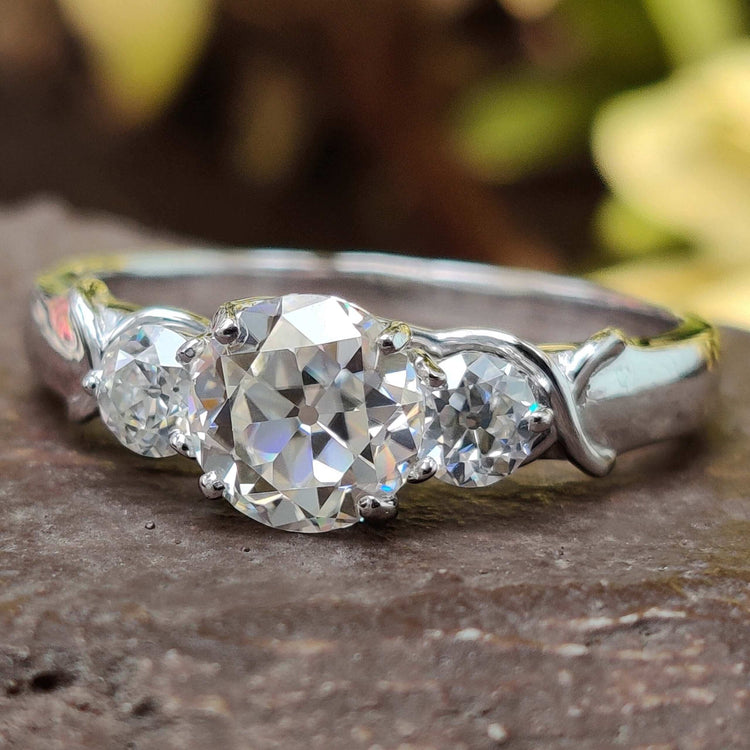 Elegant Three Stone Moissanite Ring with brilliant sparkle.