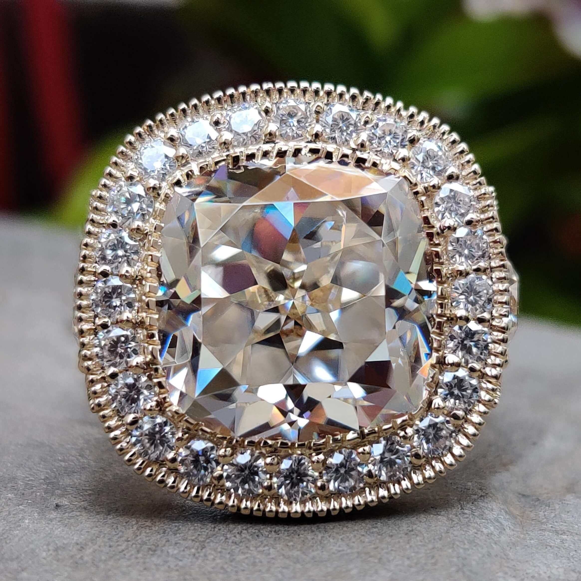 Cushion Rensu cut moissanite engagement ring in yellow gold.