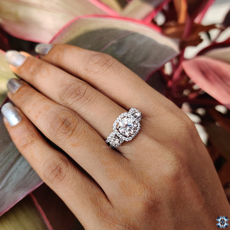 Split shank pave ring with round cut center stone.