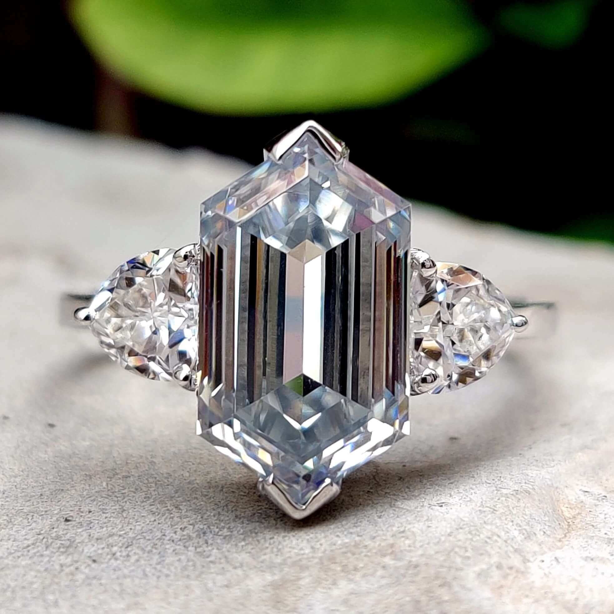 Hexagon cut moissanite engagement ring in white gold.