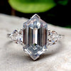 Hexagon cut moissanite engagement ring in white gold.