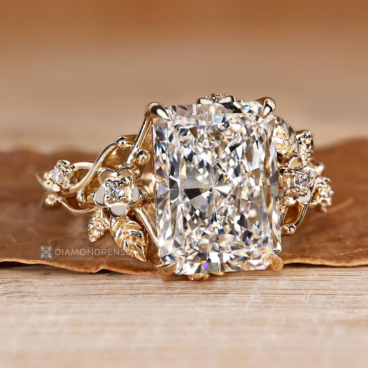 Handmade radiant diamond ring with four claw prongs.