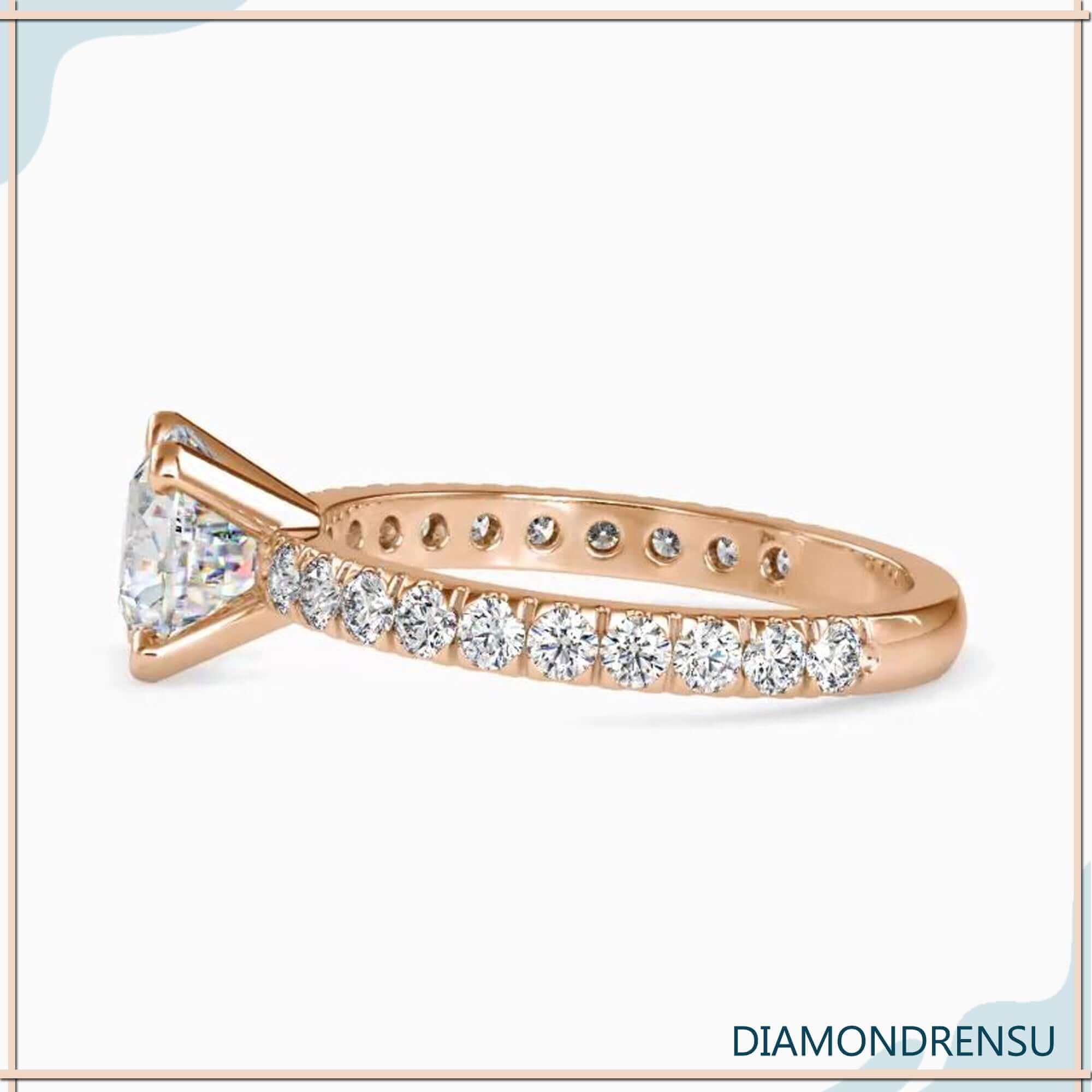 Yellow gold diamond ring with round cut pave band.