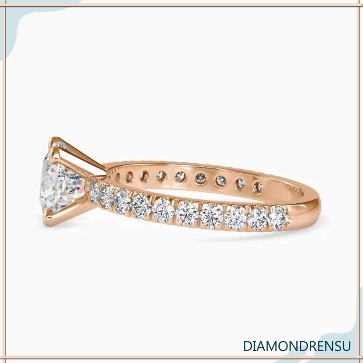 Yellow gold diamond ring with round cut pave band.