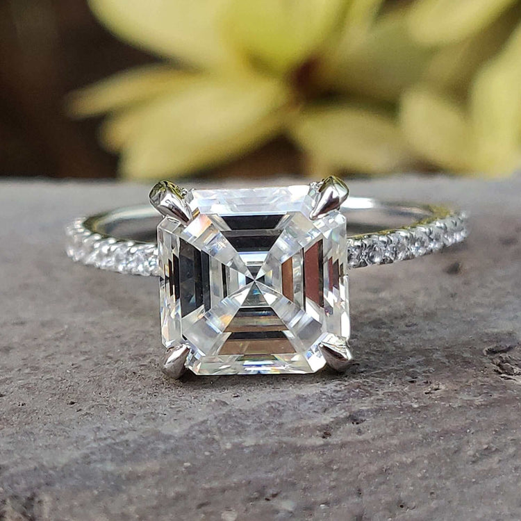 Asscher cut engagement ring with hidden halo Moissanite and pave band in white gold.