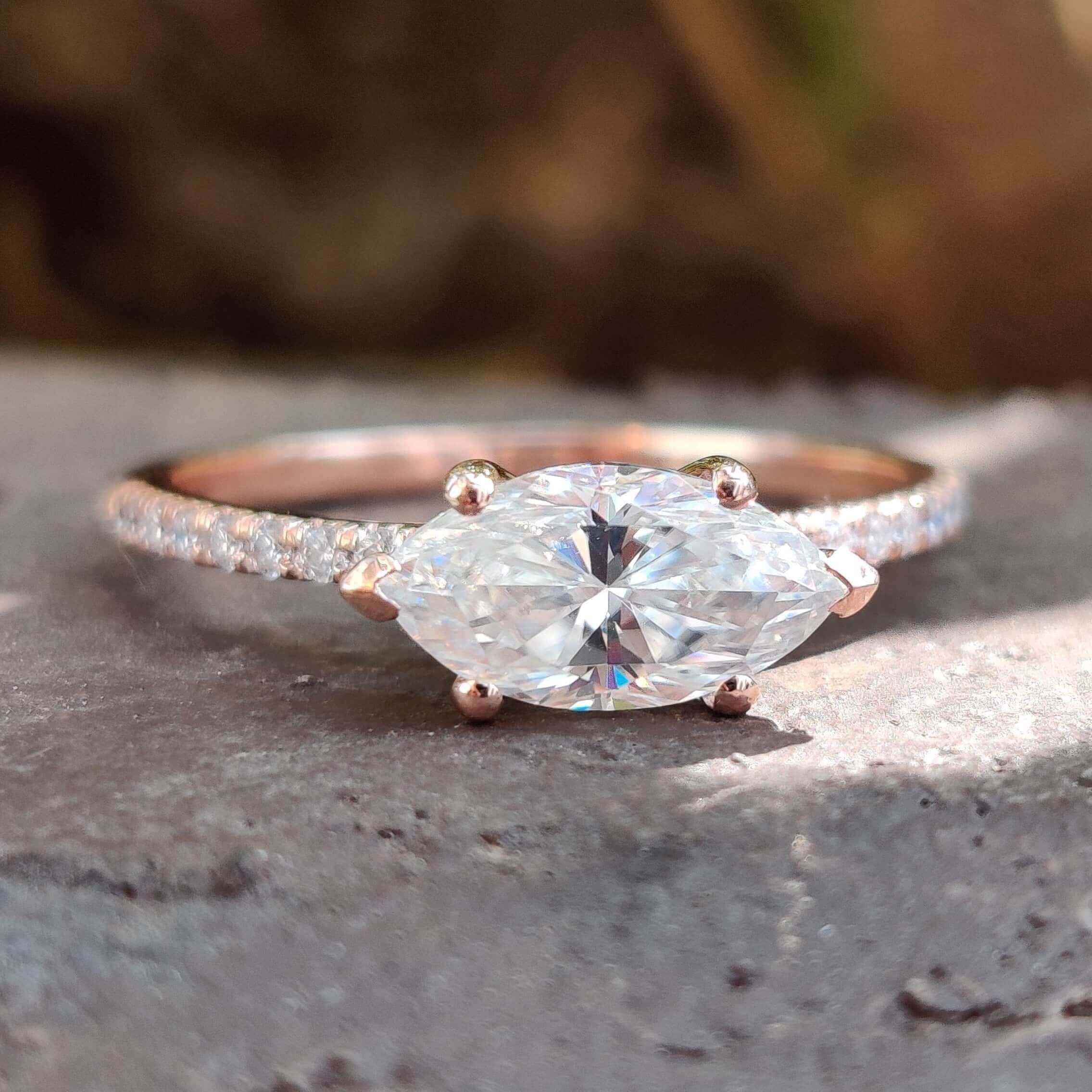 East to west marquise moissanite ring in rose gold.