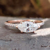 East to west marquise moissanite ring in rose gold.