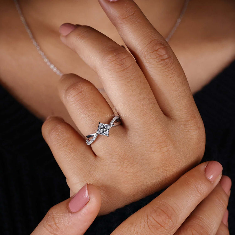 Diamond ring princess cut with a shimmering pave band.