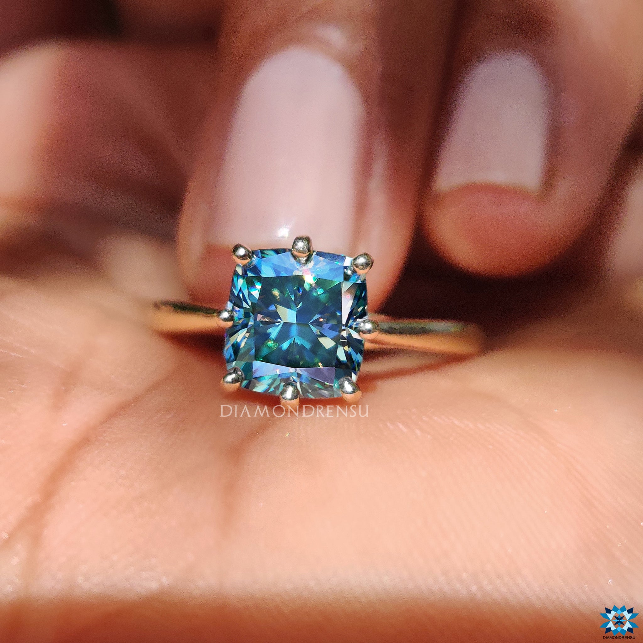 Moissanite for engagement ring in cushion cut with 8 prong setting.