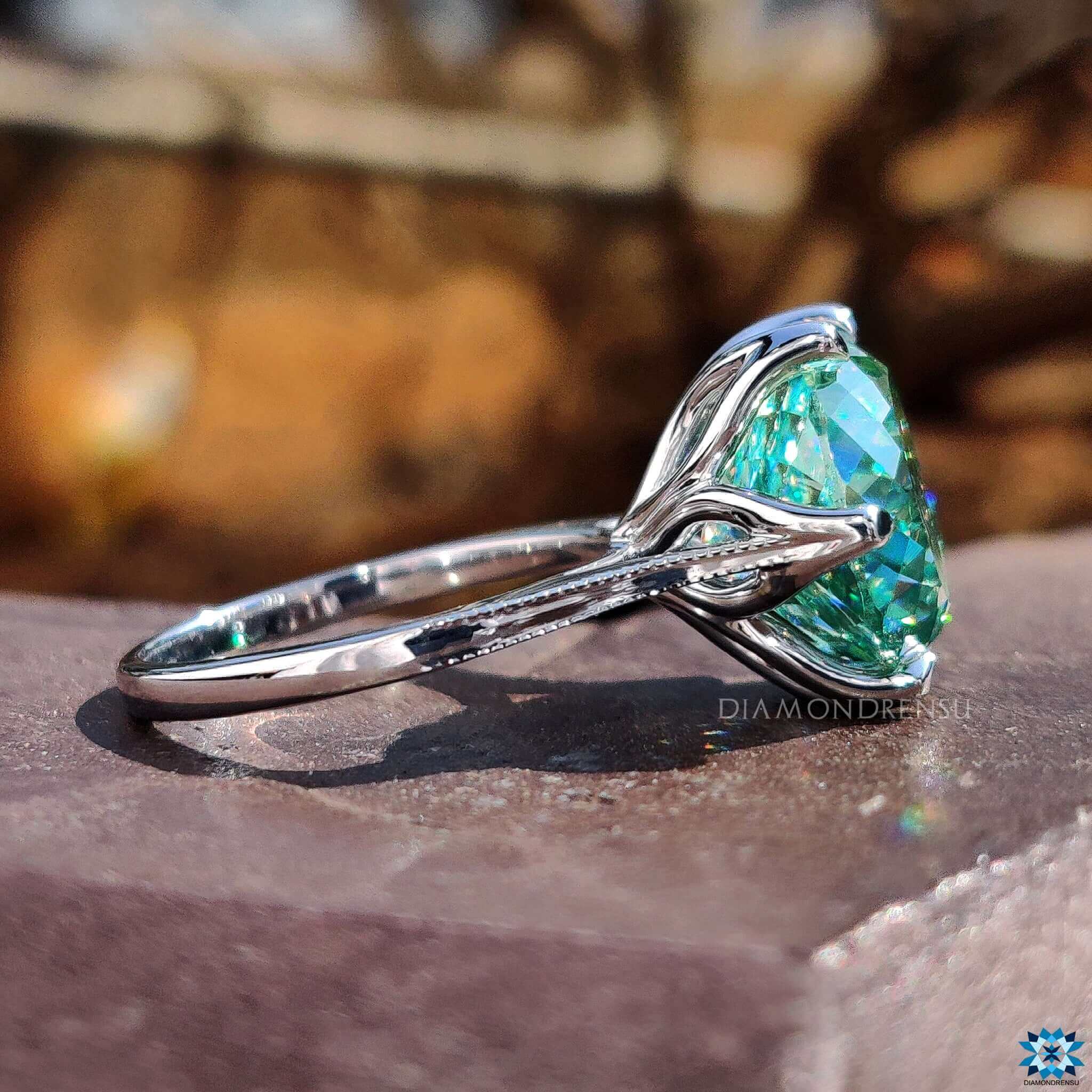 cyan blue Portuguese cut moissanite ring in prong setting.