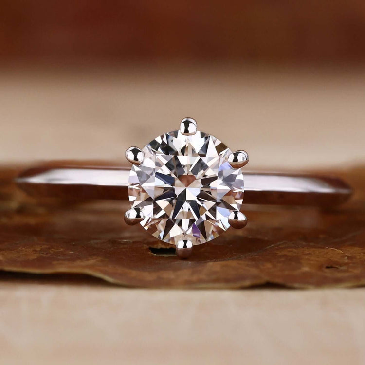 Hidden Halo Engagement Ring with a brilliant cut diamond and a sleek knife edge shank design for timeless elegance.