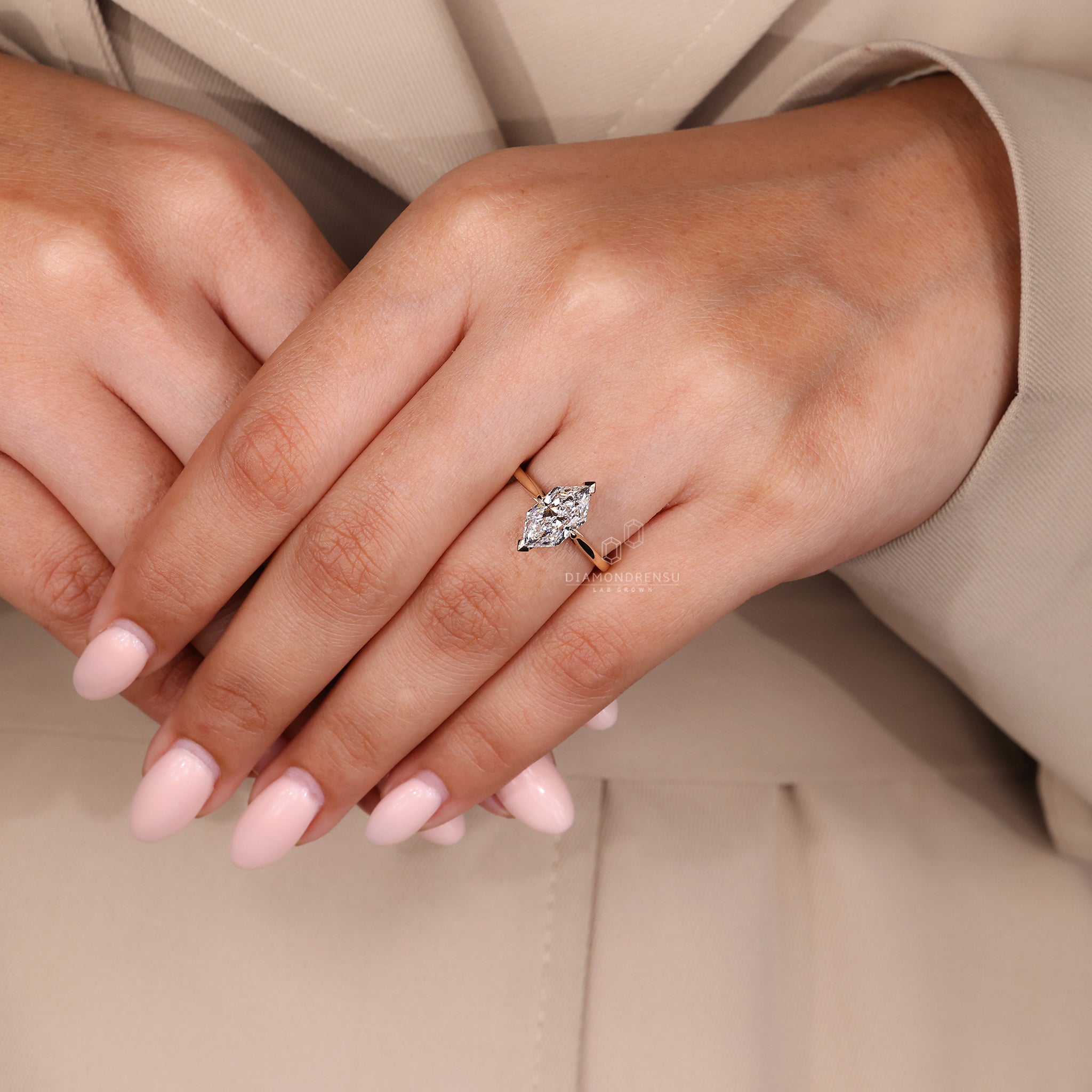 Round cut hidden halo setting designed in yellow gold finish.