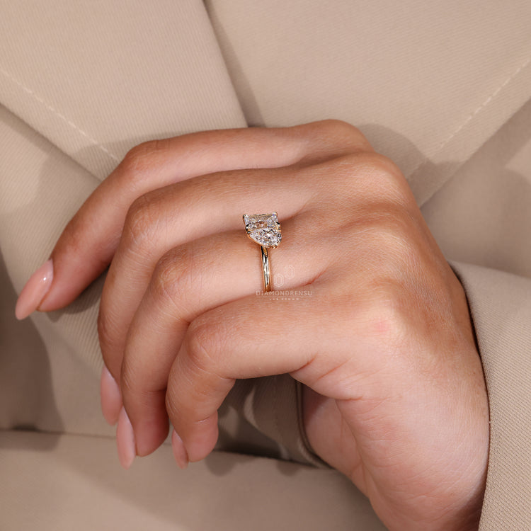 UK engagement ring with claw prong setting and gold metal.