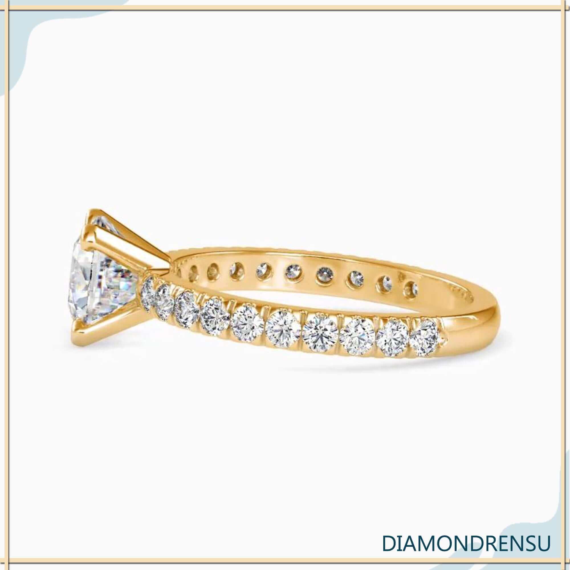 UK engagement ring with cushion cut centre diamond.