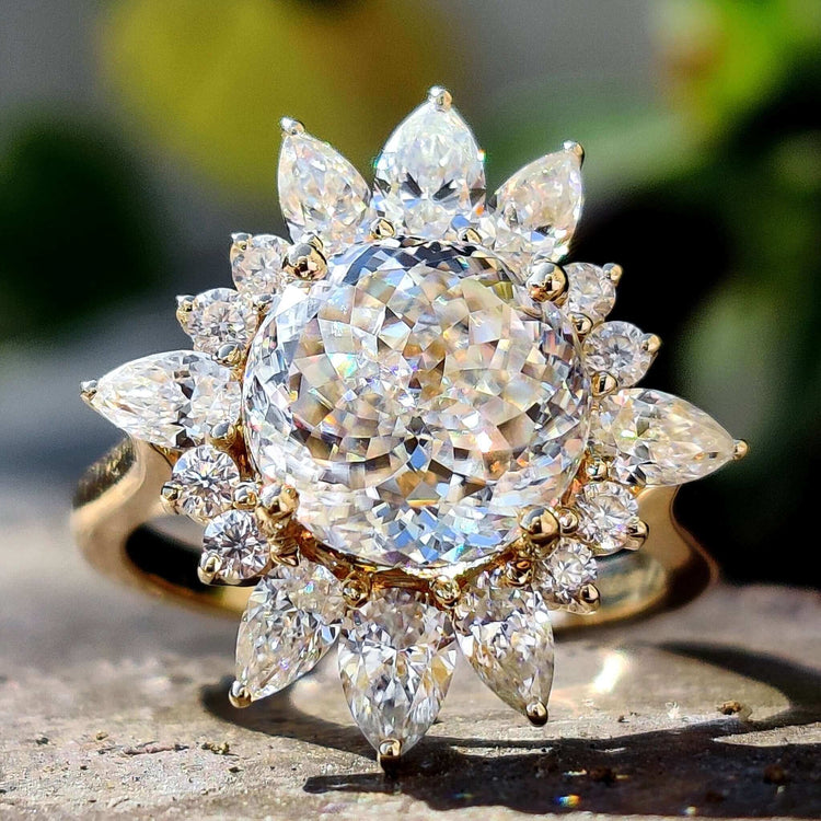 Portuguese cut moissanite engagement ring in yellow gold.