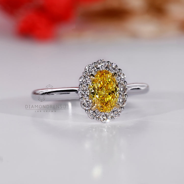 Oval diamond ring with 4 claw prong setting.