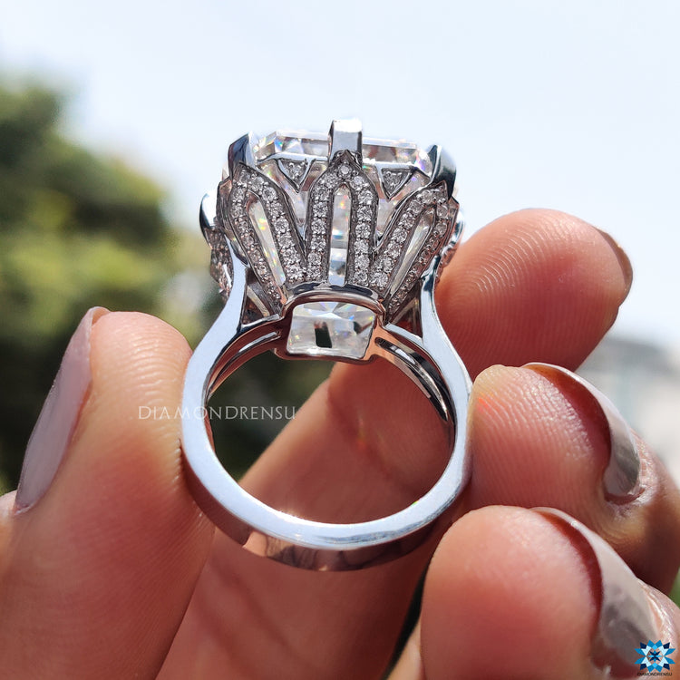 Cathedral setting engagement ring with crown motif and round side stones.