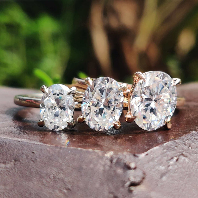 Oval moissanite ring in solitaire setting.