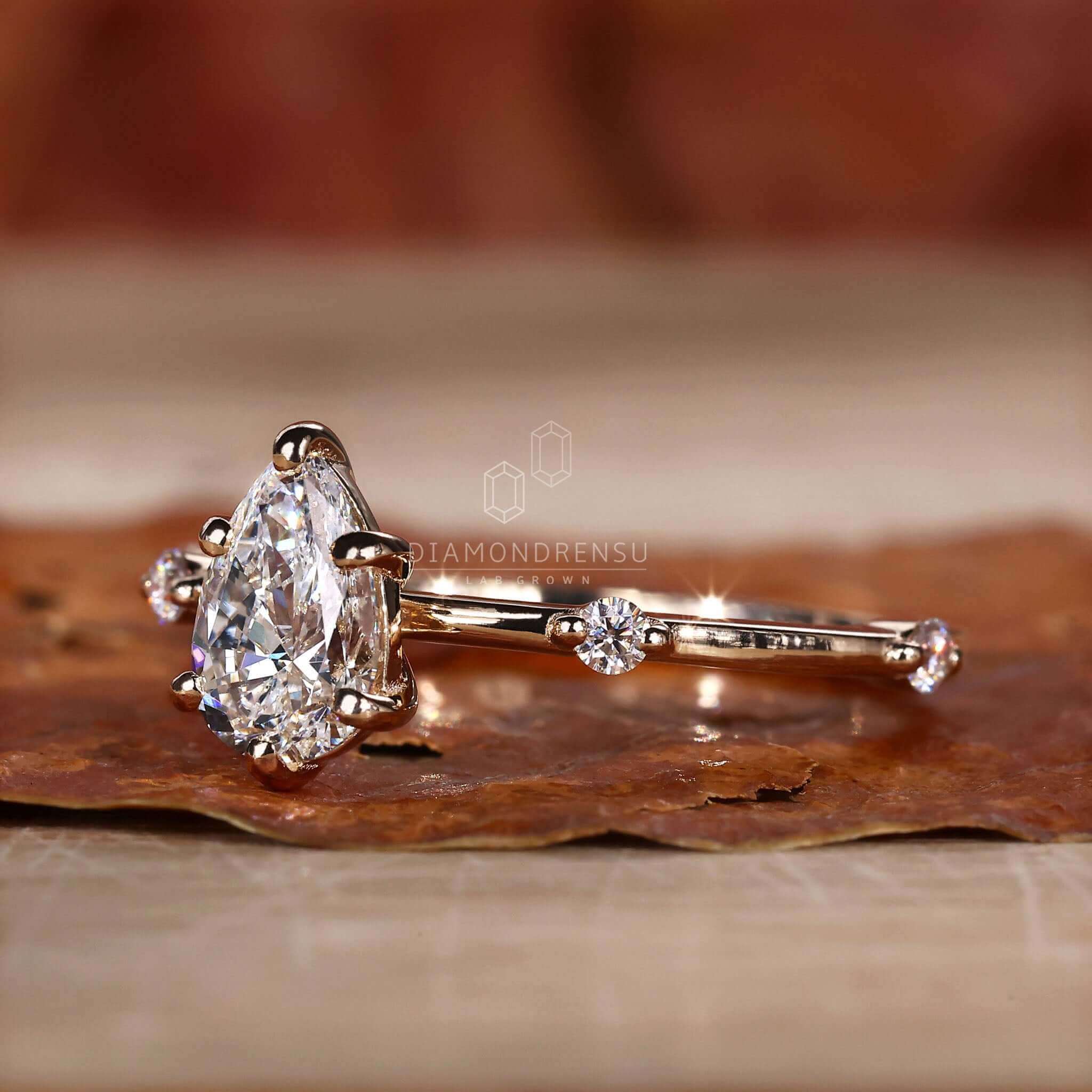 Pear shaped ring diamond with a Distance Pave Engagement Ring design, ideal for women seeking unique styles.